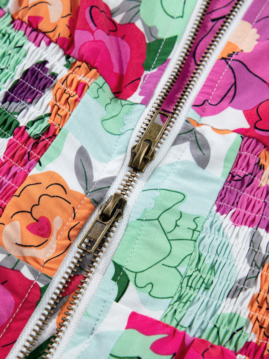 Floral V-neck zip midi dress with smocked bodice and colorful floral print.