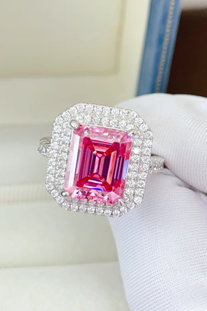 Emerald cut pink diamond ring with halo setting