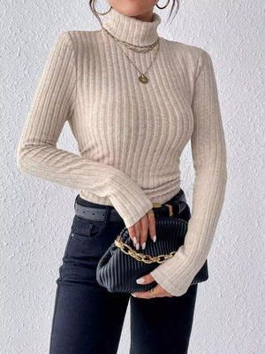Khaki ribbed turtleneck long sleeve tee with a fitted silhouette.