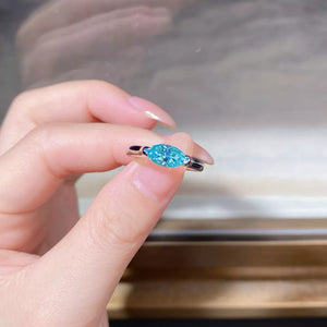 925 sterling silver, Moissanite Carat weight: 1CT Care instructions: Avoid weari ring in light blue with ring silhouette