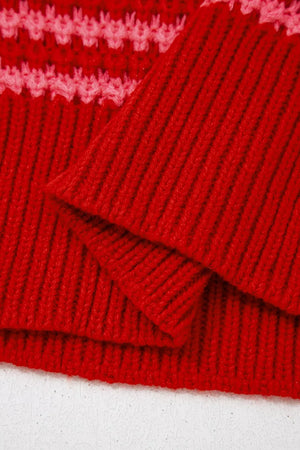 Red acrylic knit sweater with wavy crochet detail and ribbed texture.