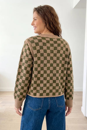 tan pullover sweater featuring drop shoulder and checkerboard