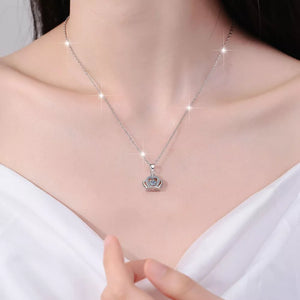 silver necklace with crown pendant and none