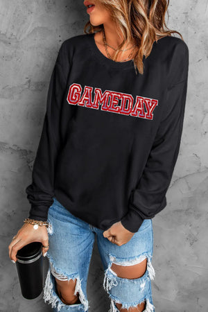 Black crewneck sweatshirt with sequined GAMEDAY appliqué and red trim