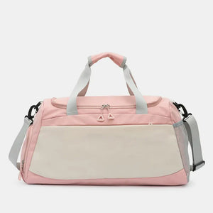 Colorblock gym duffel bag in blush pink and beige with dual zippers and adjustable strap.