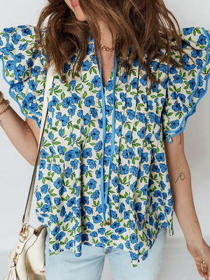 Floral ruffle sleeve tie-neck blouse with blue floral print and ruffled trim.