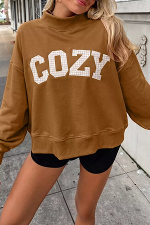 65% polyester, 35% cotton Care instructions: Machine wash cold sweatshirt in Caramel with oversized silhouette