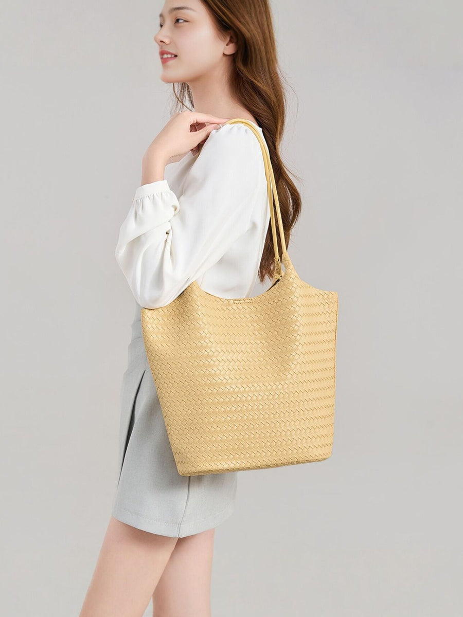 Yellow tote featuring woven texture and woven texture