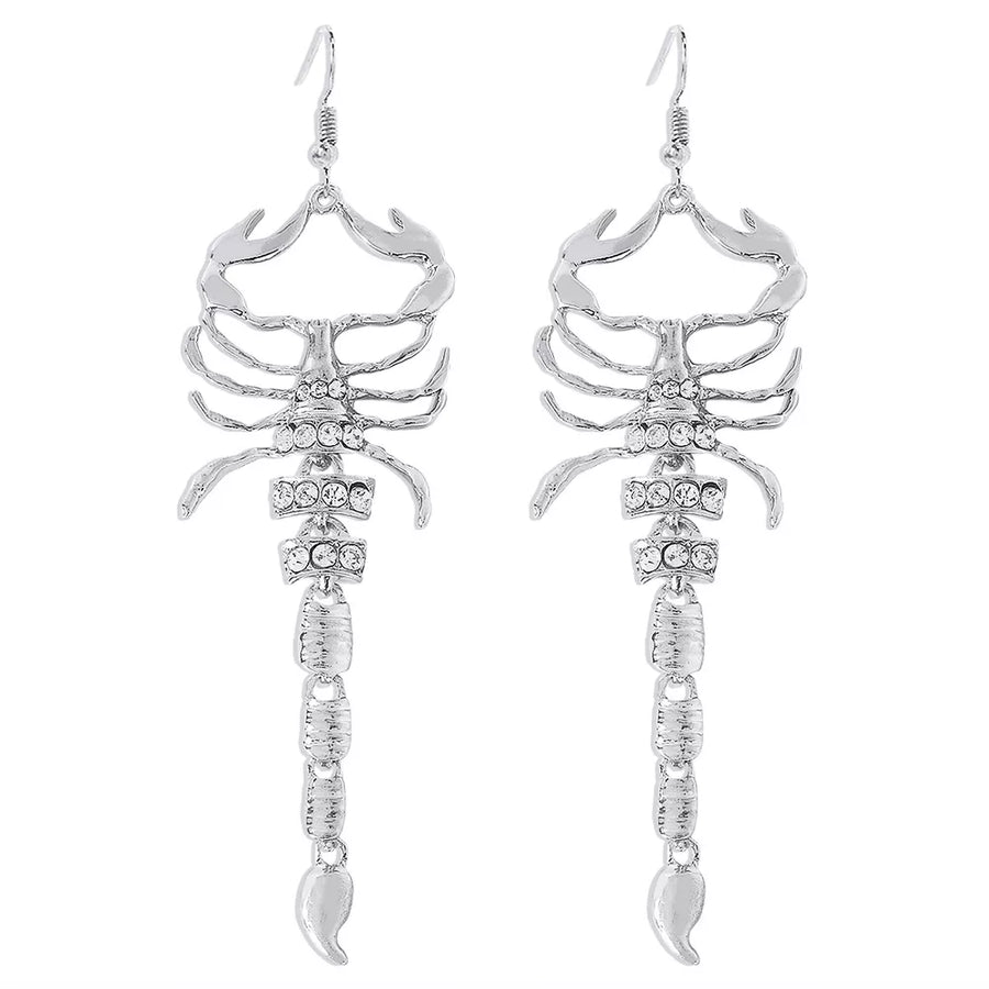 Gold earrings with fish hook and animal motif