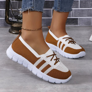 Brown and white breathable knit lace-up sneakers with striped accents.