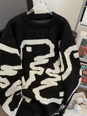 Black knit sweater with white abstract graphic and crew neck