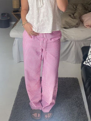 100% polyester Care instructions: Machine wash cold wide-leg pants in Pink with loose silhouette