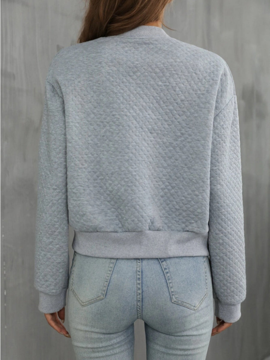 Gray diamond quilted bomber jacket with ribbed cuffs and hem