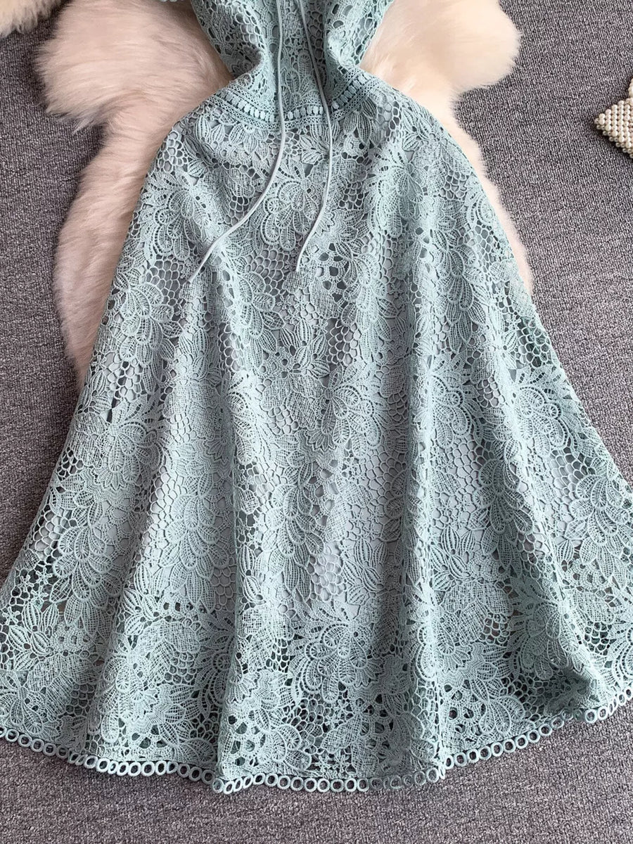 Sky blue floral lace A-line dress with tie detail and cutout design.