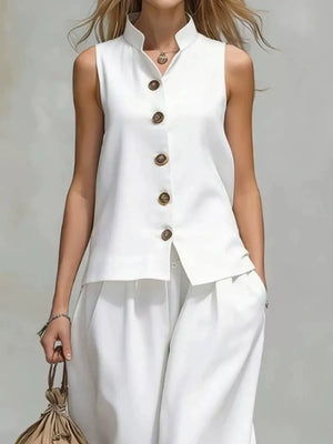 White two-piece set with hip-length top, full-length pants and button-front