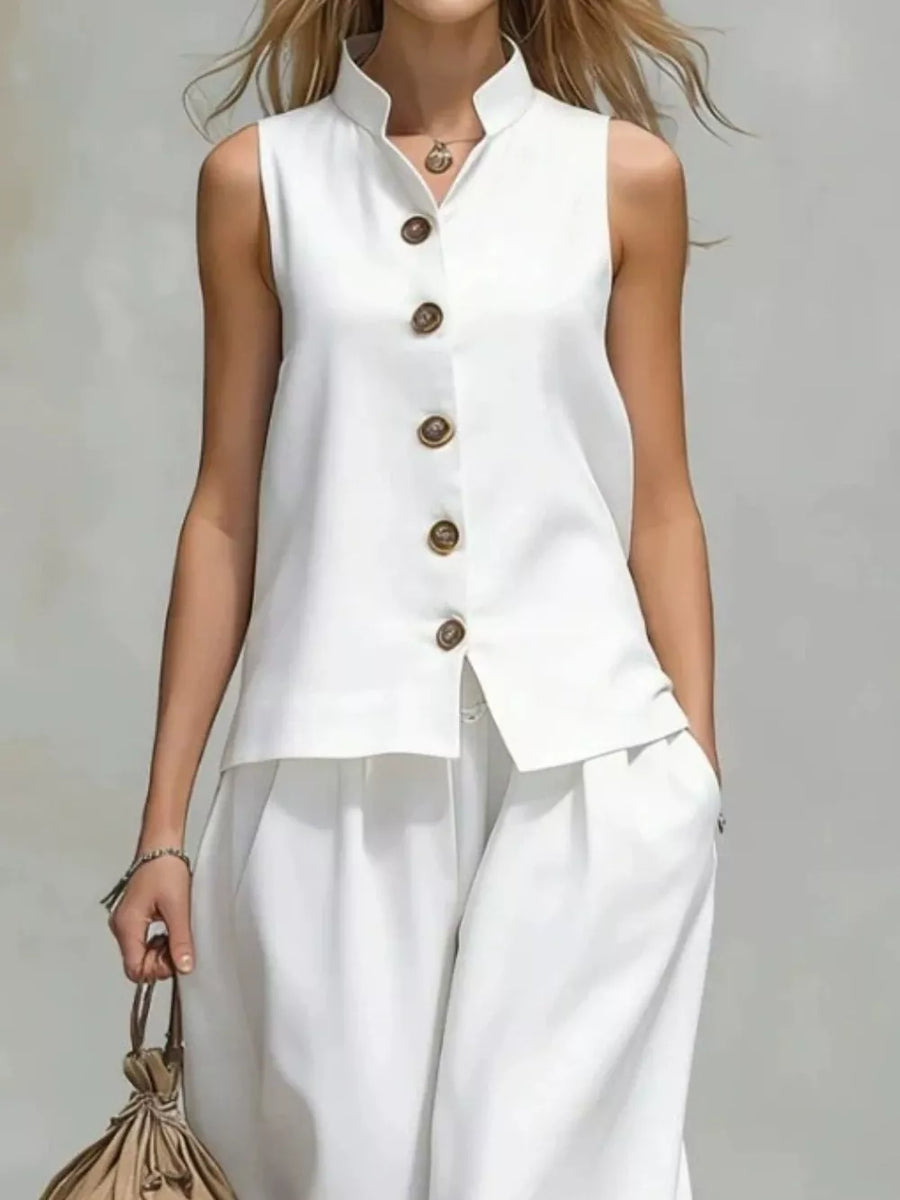 White two-piece set with hip-length top, full-length pants and button-front