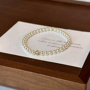 Synthetic Pearl, 18K Gold-Plated, Alloy, Zircon Care instructions: Avoid wearing bracelet in White with fitted silhouette