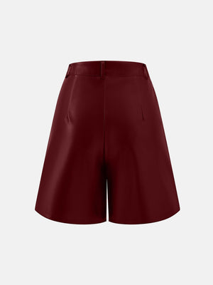 Burgundy vegan leather bermuda shorts with buttoned waist and tailored fit