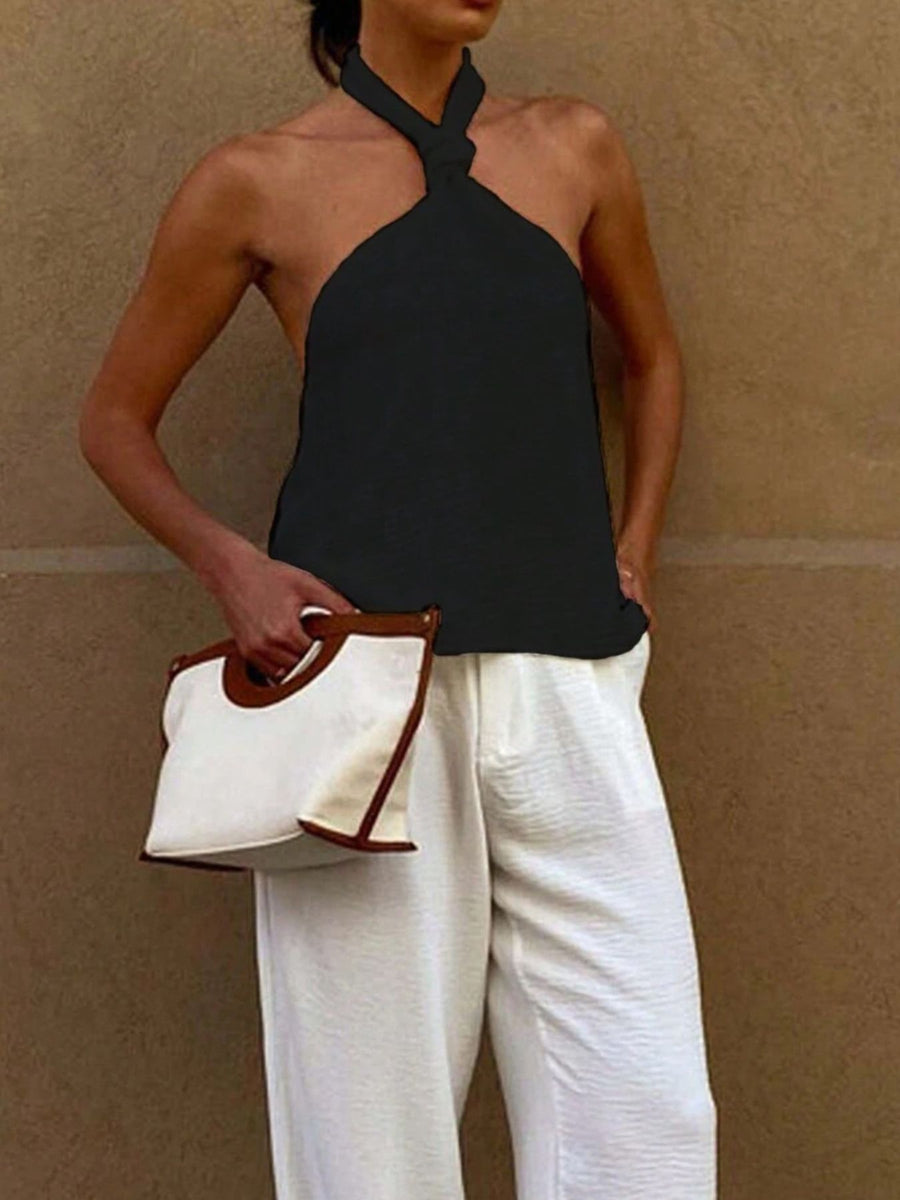 Black twisted backless halter cami with a knotted neckline.
