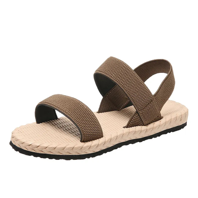 Tan rope-sole cross-strap sandals with adjustable straps and textured footbed.