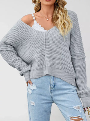 Gray pullover sweater featuring waffle-knit and waffle-knit