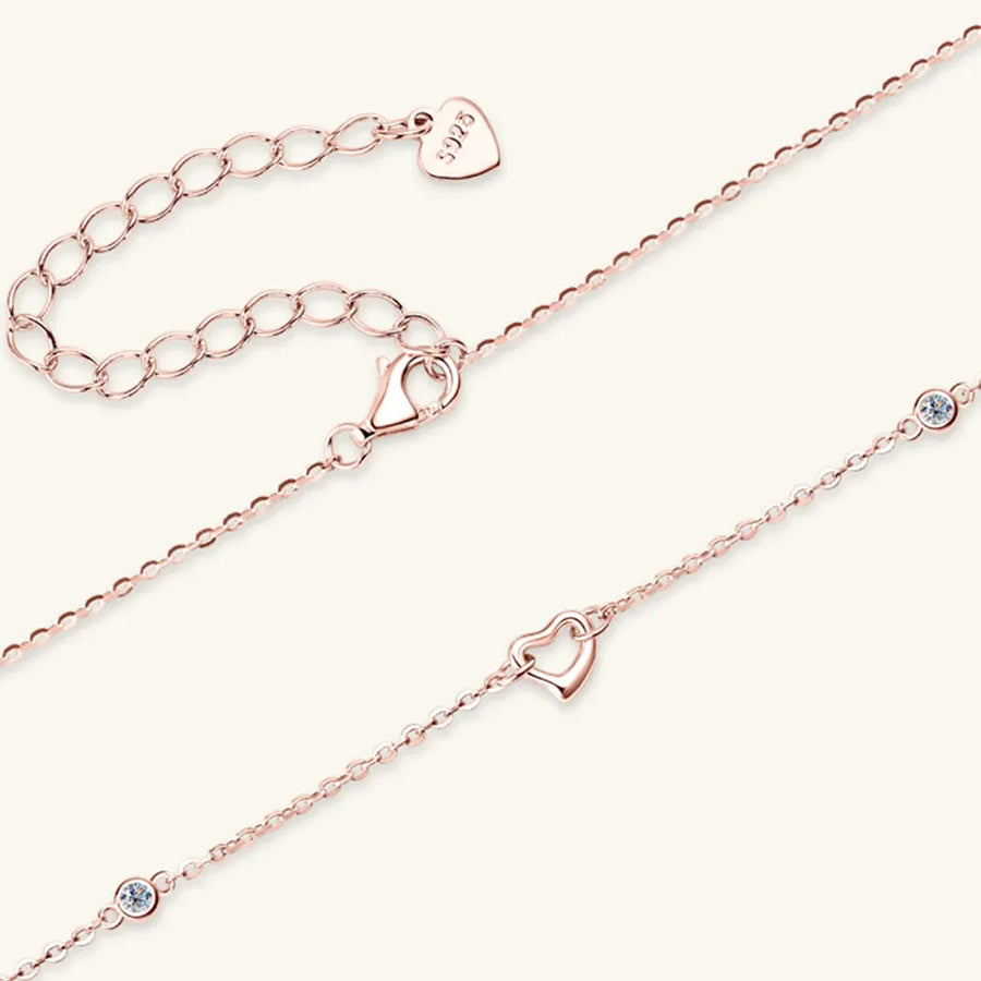 Rose gold linked heart pendant necklace with crystal accents and 925 stamp.