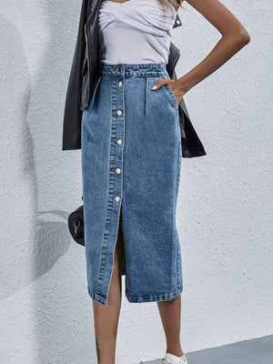 Button-front denim midi skirt in light wash with pleats and a front slit.