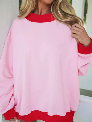 bright red sweatshirt featuring oversized and color-block