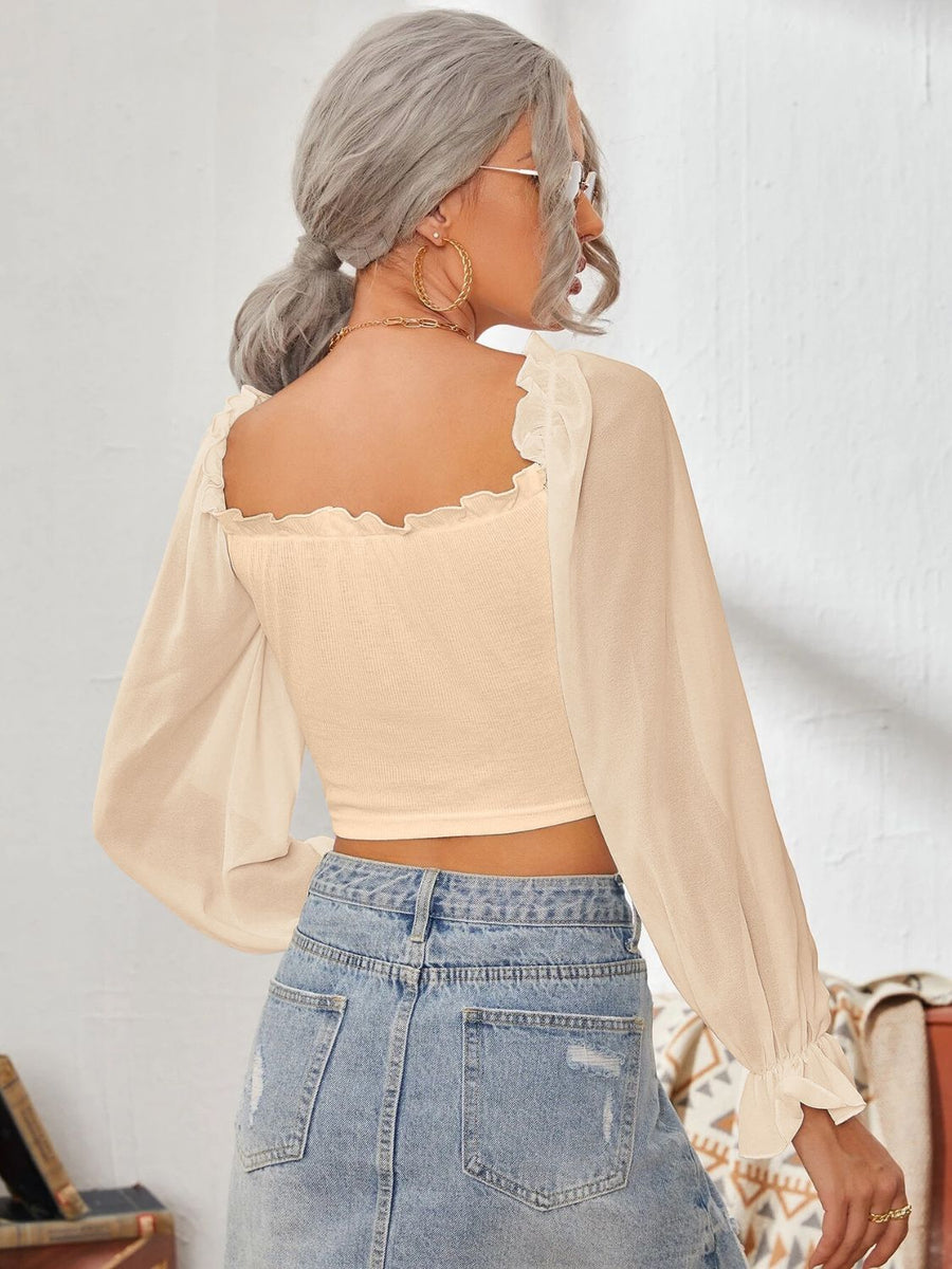Tan bustier blouse with square neckline, ruffled trim, and sheer bishop sleeves.