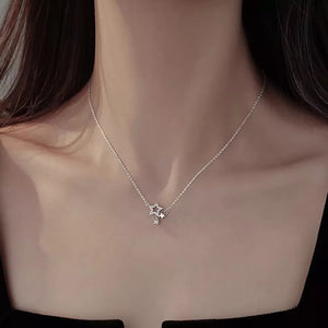 Silver necklace featuring zircon accents and star