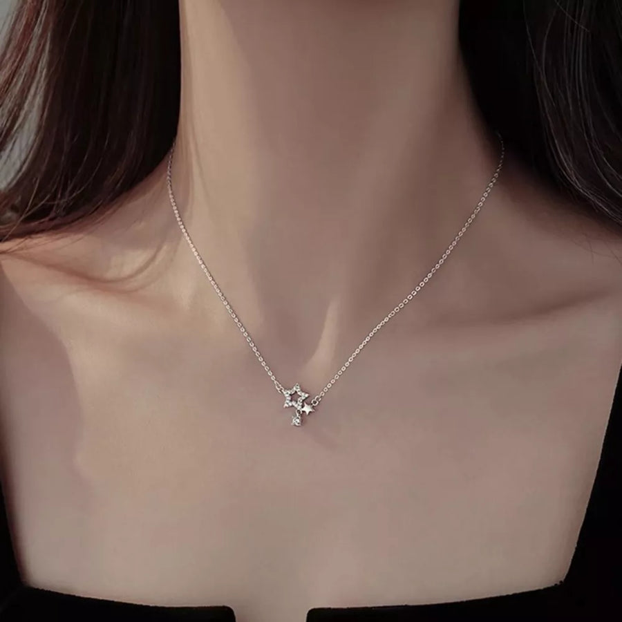 Silver necklace featuring zircon accents and star