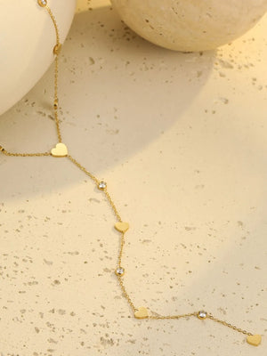 clear necklace featuring heart charms and geometric