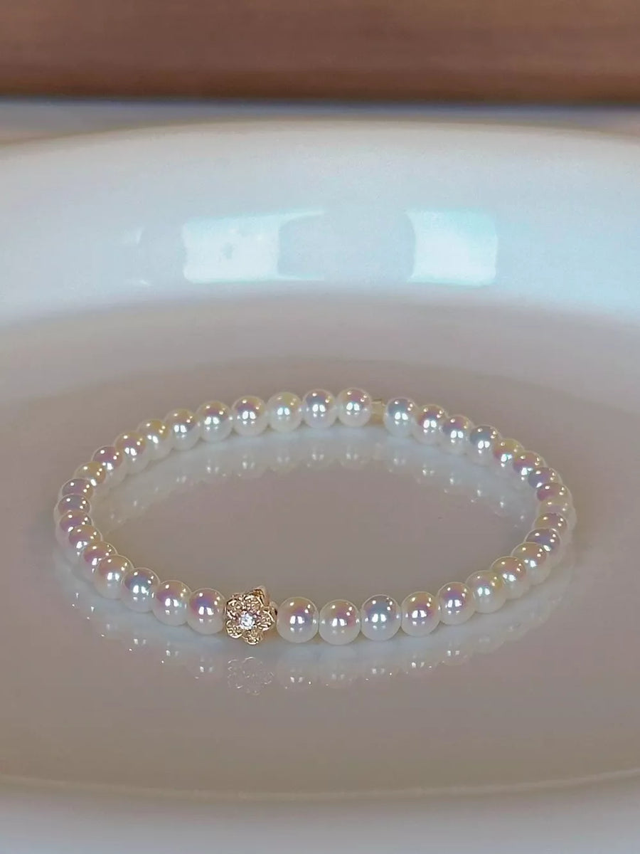 bracelet featuring floral in White with Synthetic Pearl,18K Gold-Plated,Alloy Care instructions: Avoid wearing during ex