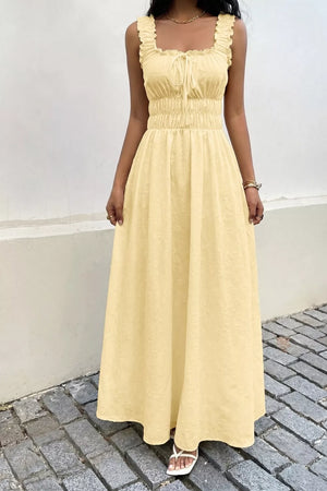 Yellow smocked floral maxi dress with frill straps and tie front.