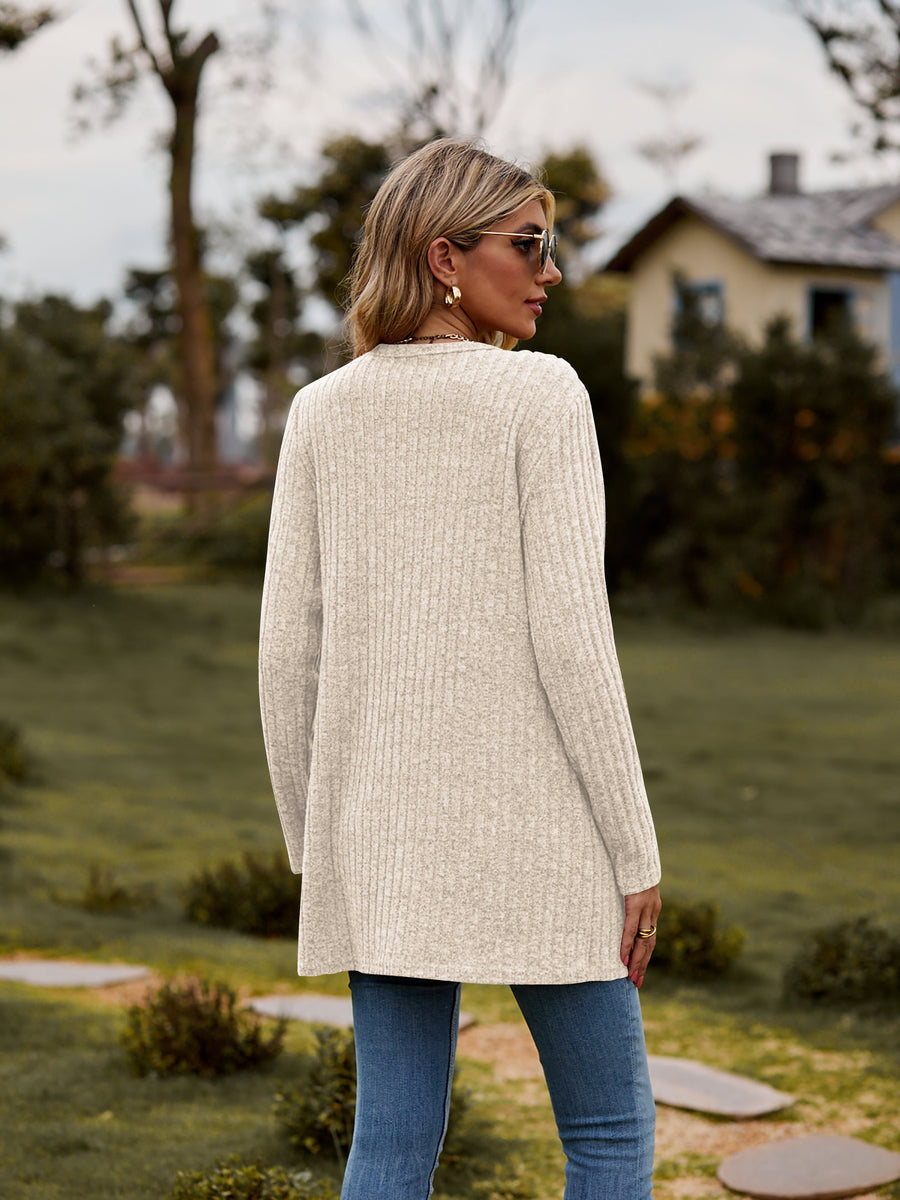 Longline ribbed knit button-down cardigan in beige with a relaxed fit.