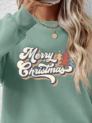 Sage green crewneck sweatshirt with Merry Christmas graphic and festive trees.