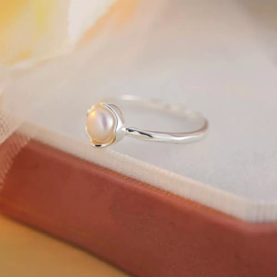 silver ring with n/a and open