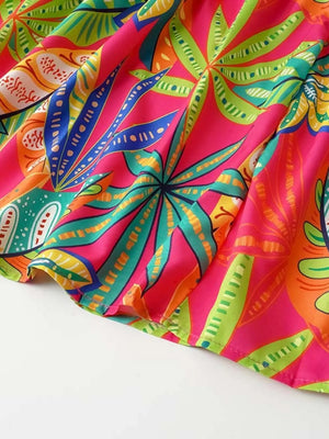 Tropical print midi dress in strawberry pink with smocked detail and tie straps.