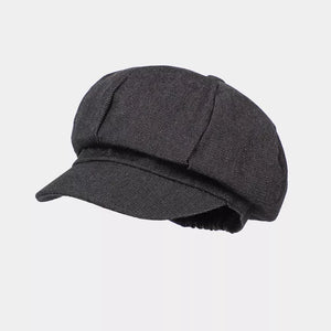 hat in black featuring elastic and relaxed fit