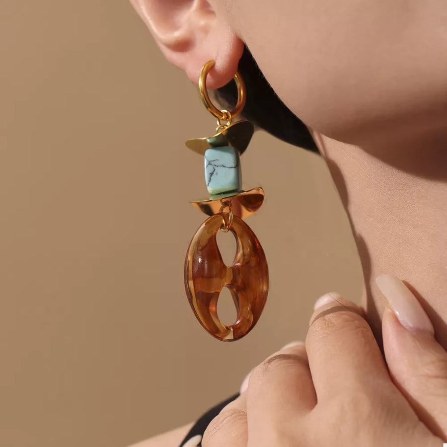 earrings in turquoise featuring geometric shapes and drop fit