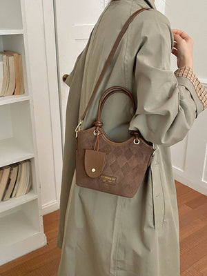 crossbody bag featuring quilted in brown with PU Leather Imported Size & texture