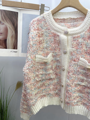 Textured bouclé knit cardigan in multi-color with jewel buttons and patch pockets.