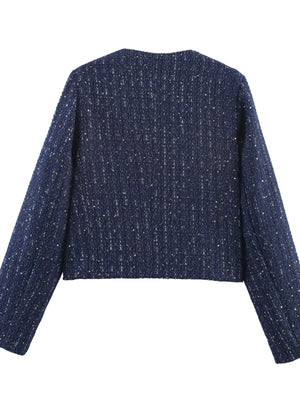 Dark blue cropped tweed jacket with metallic threads and a round neckline.