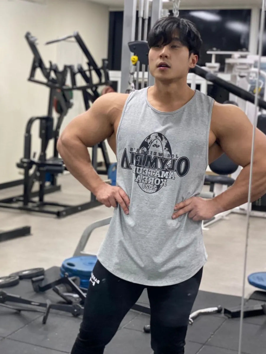Gray graphic muscle tank top with a circular logo on the chest.