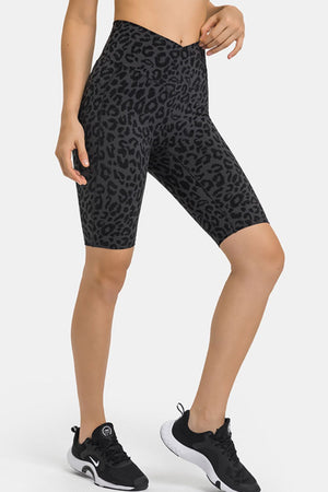 V-waist biker shorts in black leopard print with pockets.
