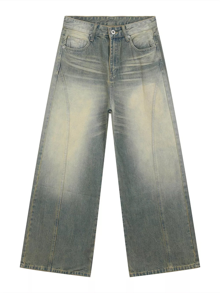 Timeless wide leg denim trousers in light blue wash with faded details and a relaxed fit.