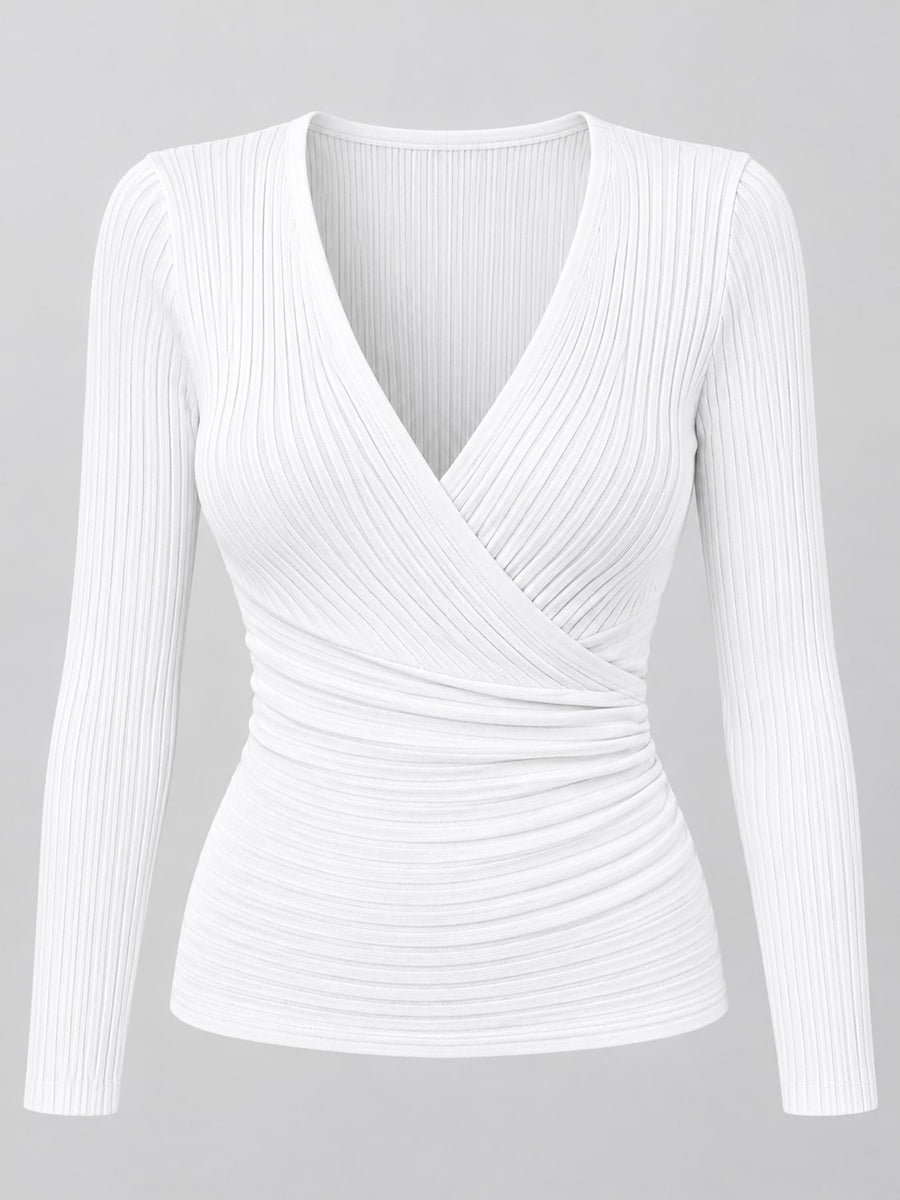 Polyester content is at least 90% and less than 95% wrap top in ivory with fitted silhouette