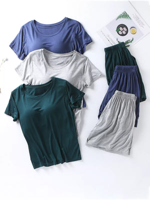 Pajama set with short sleeve tops and elastic waistband shorts in Space Blue, Heather Gray, and Fini Green.