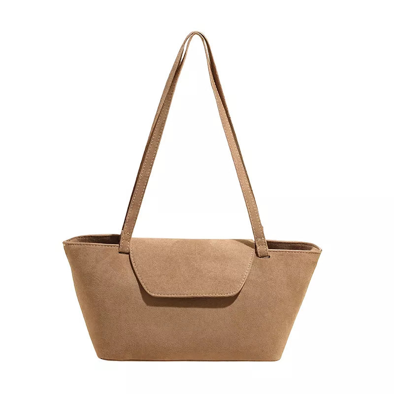 Sleek suede flap tote bag in khaki with single shoulder strap and flap closure.
