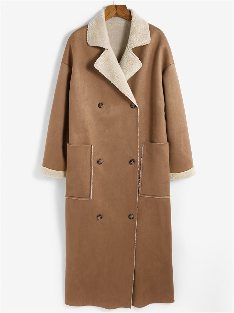 Brown reversible maxi coat with shearling trim, double-breasted closure, and patch pockets.